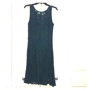 A sleeveless dark green dress. In great condition